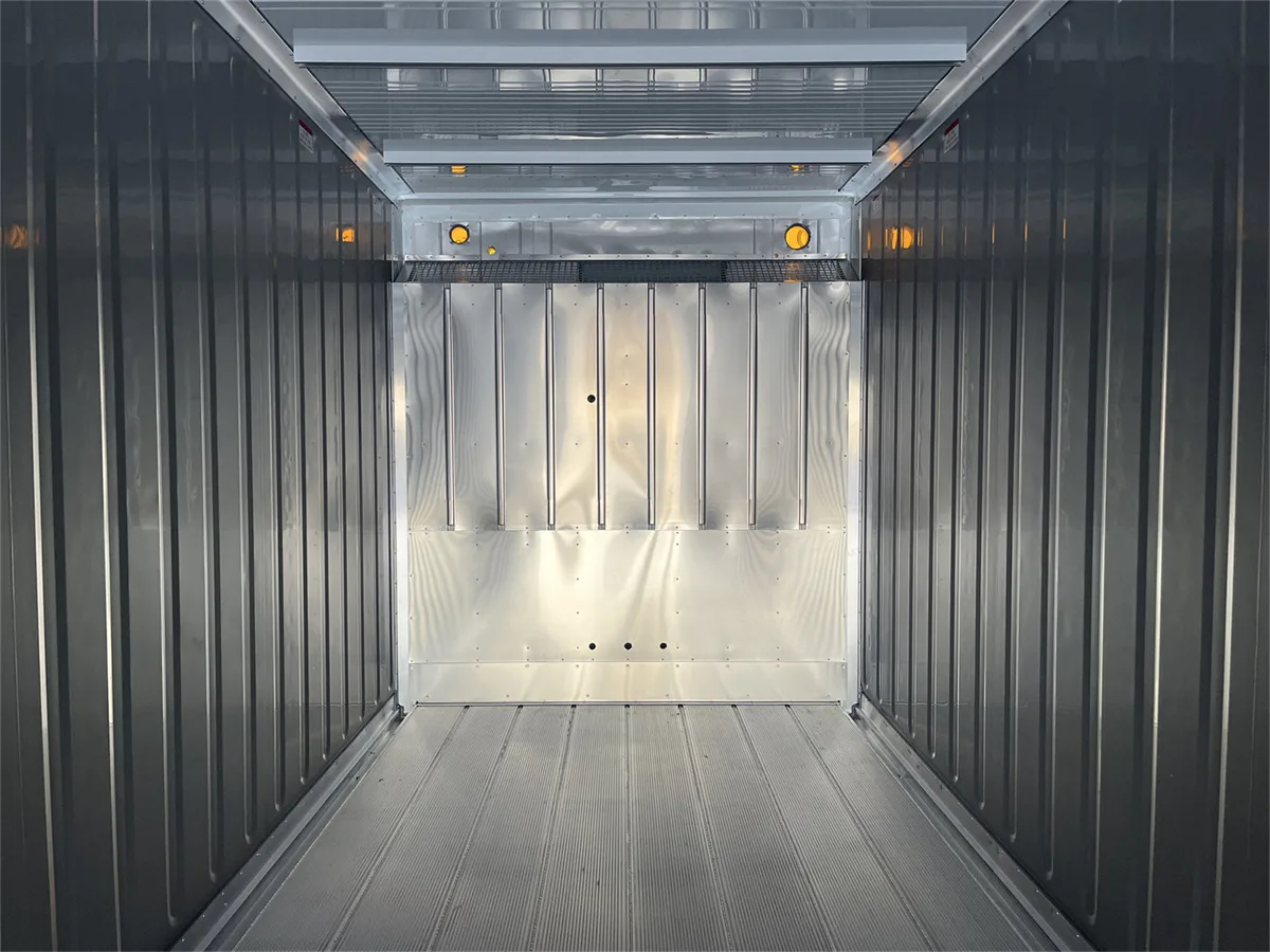 Interior of an OWL-built reefer container showing aluminum wall lining, T-floor, and air-distribution channel